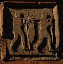 Relief depicting two men carrying an amphora, Pompeii, Italy, 2009. Creator: LTL