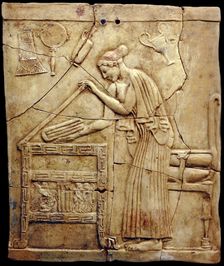 Relief pinax from Locri depicting a woman placing laundry in a laundry chest, Mid of the 5th cen. BC Creator: Classical Antiquities