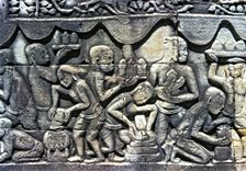 Relief showing an everyday scene in the temples of Angkor Thom in Cambodia