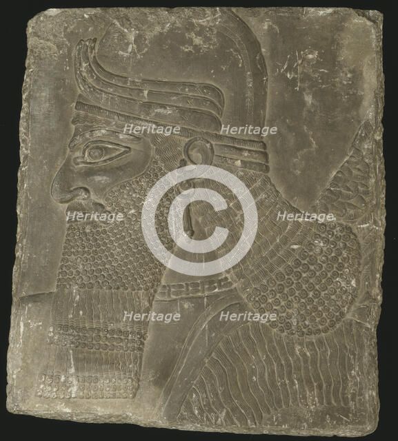 Relief Showing the Head of a Winged Genius, Neo-Assyrian Period, reign of Ashurnasirpal II (883-859  Creator: Unknown.