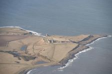 Remains of the 14th century Dunstanburgh Castle, Northumberland, 2015. Creator: Historic England
