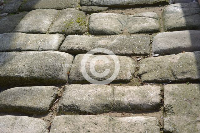 Remains of a Roman road next to the Valmardon Gate, paved with granite slabs, Toledo, Spain, 2022. Creator: LTL.