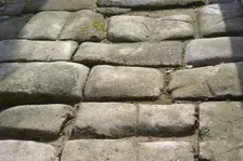 Remains of a Roman road next to the Valmardon Gate, paved with granite slabs, Toledo, Spain, 2022. Creator: LTL