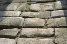 Remains of a Roman road next to the Valmardon Gate, paved with granite slabs, Toledo, Spain, 2022. Creator: LTL
