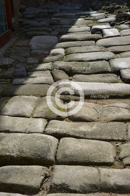 Remains of a Roman road next to the Valmardon Gate, paved with granite slabs, Toledo, Spain, 2022.  Creator: LTL.
