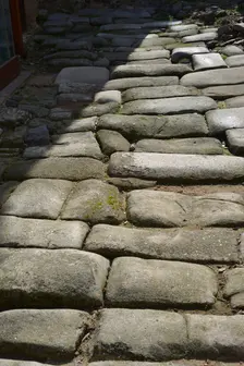 Remains of a Roman road next to the Valmardon Gate, paved with granite slabs, Toledo, Spain, 2022. Creator: LTL