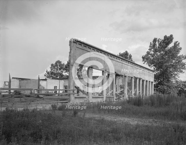 Remains of storefronts in Fullerton, Louisiana, an abandoned lumber town, 1937. Creator: Dorothea Lange.