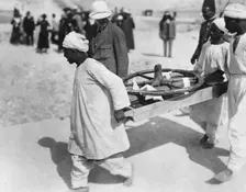 Removing a chariot wheel from the Tomb of Tutankhamun, Valley of the Kings, Egypt, 1922. Creator: Harry Burton