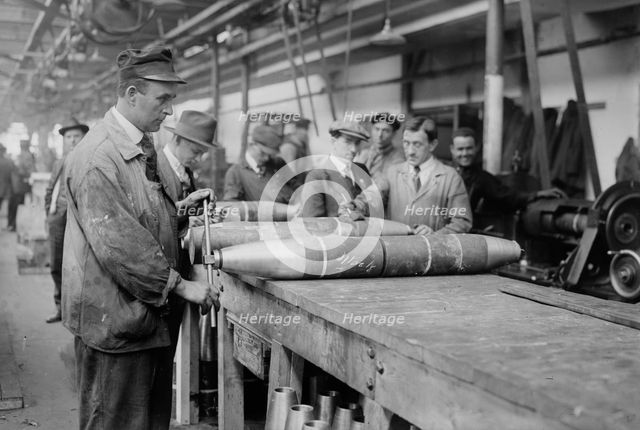 Removing nose from 6 inch shell, between c1915 and c1920. Creator: Bain News Service.