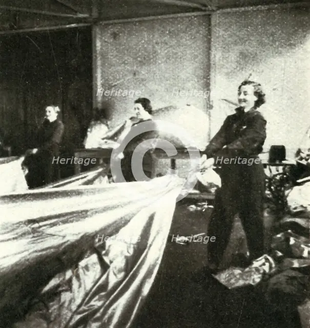 'Repairing Barrage Balloons', c1943. Creator: Cecil Beaton.