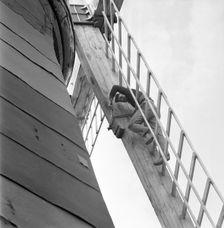 Repairing the sails of a windmill, Säbyholm, Sweden, 1964. Creator: Unknown