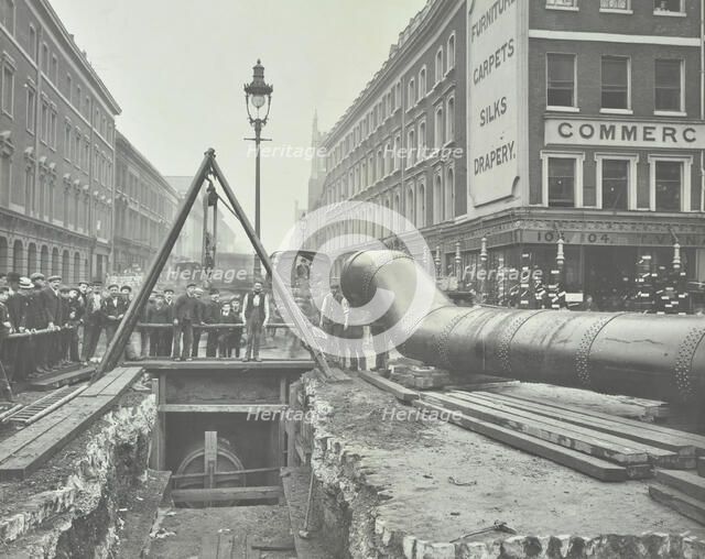Replacing an old gas main, Commercial Street, London, 1906. Artist: Unknown.