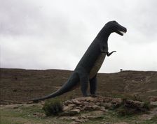 Reproduction of a dinosaur at the footprints site of such animals