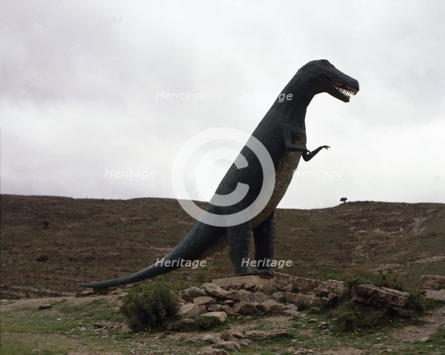 Reproduction of a dinosaur at the footprints site of such animals.