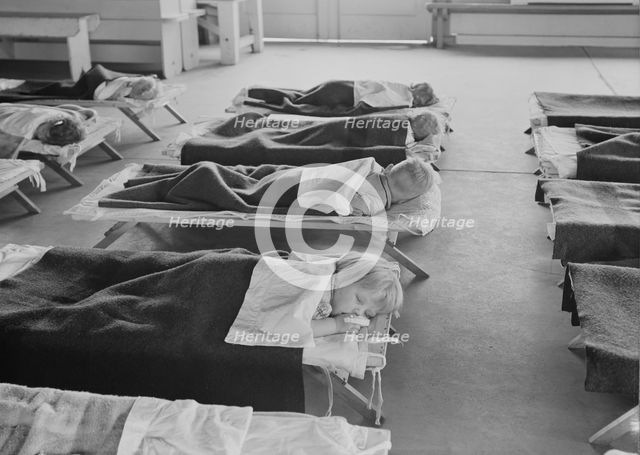 Rest time in nursery school for migrant children at Shafter Camp, California, 1939. Creator: Dorothea Lange.