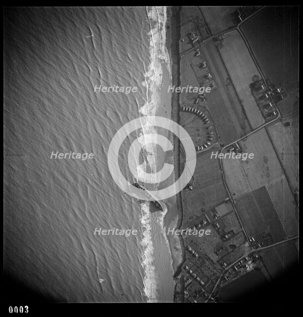 RFA tanker Olcades, beached following a high spring tide and massive gales, Walcot, Norfolk, 1953. Artist: RAF photographer.