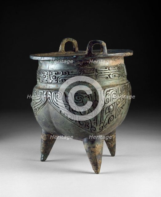 Ritual food vessel, or li ding, with taotie masks, Shang Dynasty, Erligang Period (c1500-c1300 BC). Artist: Unknown.