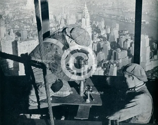 'Rivetting the last bolts on The Morning Mast of the Empire State building', c1931. Artist: Lewis Wickes Hine.