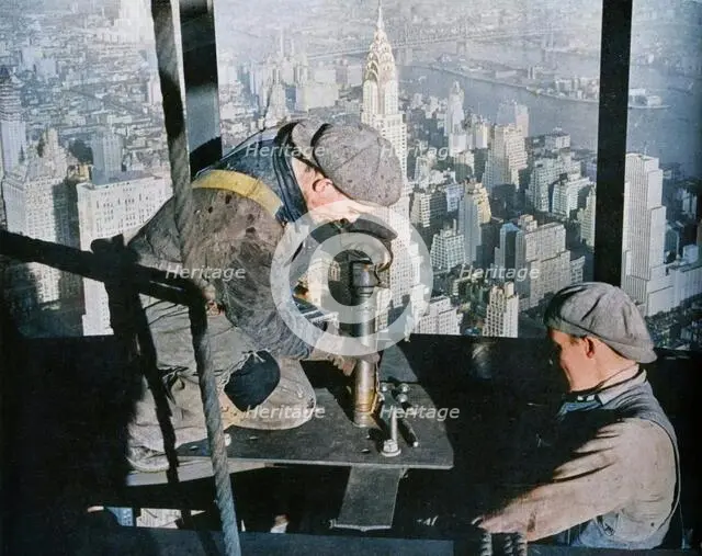 'Rivetting the last bolts on "The Morning Mast" of the Empire State building', c1931. Creator: Lewis Wickes Hine.