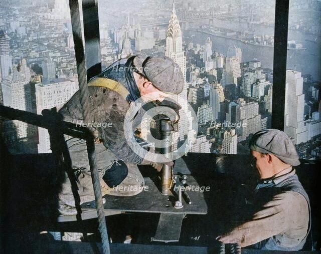 'Rivetting the last bolts on "The Morning Mast" of the Empire State building', c1931. Creator: Lewis Wickes Hine.