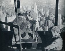 Rivetting the last bolts on The Morning Mast of the Empire State building c1931. Artist: Lewis Wickes Hine