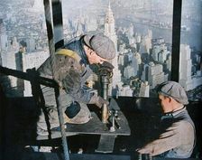 Rivetting the last bolts on "The Morning Mast" of the Empire State building c1931. Creator: Lewis Wickes Hine