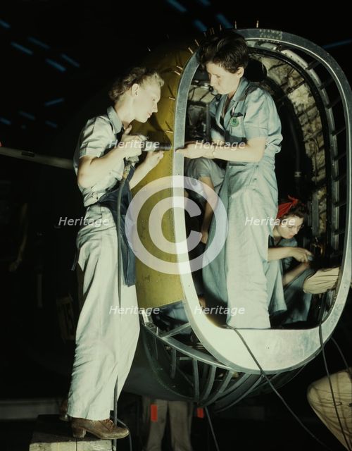 Riveters at work on fuselage of Liberator..., Consolidated Aircraft Corp., Fort Worth, Texas, 1942. Creator: Howard Hollem.