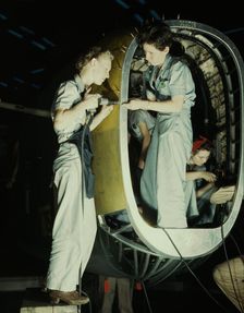 Riveters at work on fuselage of Liberator..., Consolidated Aircraft Corp., Fort Worth, Texas, 1942. Creator: Howard Hollem