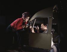 Riveting team working on the cockpit shell of a...Douglas Aircraft Co., Long Beach, Calif. , 1942. Creator: Alfred T Palmer