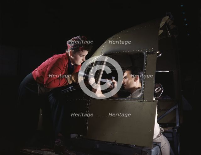 Riveting team working on the cockpit shell of a...Douglas Aircraft Co., Long Beach, Calif. , 1942. Creator: Alfred T Palmer.
