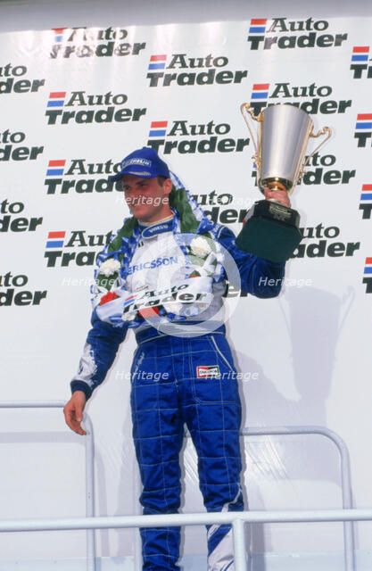 Rickard Rydell celebrates victory.British touring cars.Thruxton. Artist: Unknown.