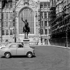 Richard Coeur de Lion and a Baby Austin in Old Palace Yard, London, c1945-c1965. Artist: SW Rawlings