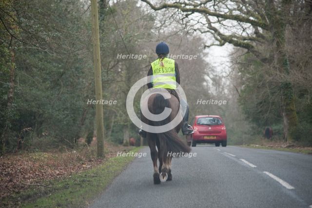Rider on horseback on country road in New Forest 2014 Artist: Unknown.