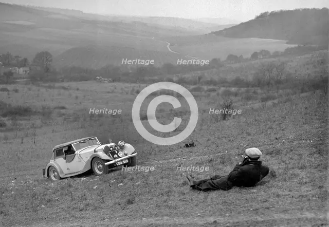 Riley 16 competing in the London Motor Club Coventry Cup Trial, Knatts Hill, Kent, 1938. Artist: Bill Brunell.