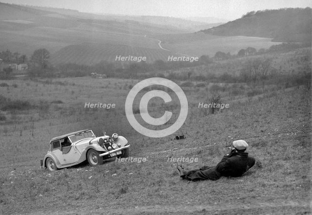 Riley 16 competing in the London Motor Club Coventry Cup Trial, Knatts Hill, Kent, 1938. Artist: Bill Brunell.