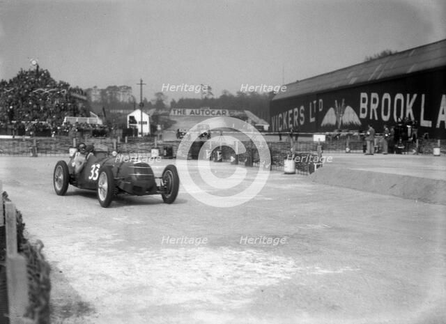 Riley 1985 cc competing in the JCC International Trophy, Brooklands, 2 May 1936. Artist: Bill Brunell.
