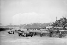 Riley 1985 cc leading MG K3 Magnette, JCC International Trophy, Brooklands, 2 May 1936. Artist: Bill Brunell