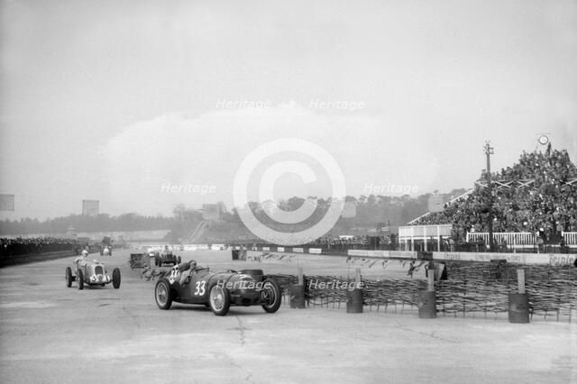 Riley 1985 cc leading MG K3 Magnette, JCC International Trophy, Brooklands, 2 May 1936. Artist: Bill Brunell.