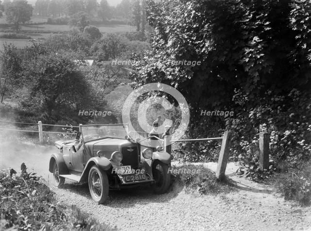Riley 4-seat tourer taking part in a West Hants Light Car Club Trial, Ibberton Hill, Dorset, 1930s. Artist: Bill Brunell.