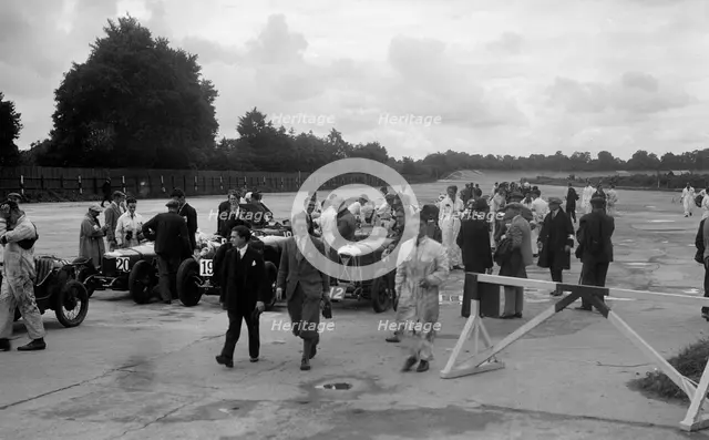 Riley 9, Aston Martin and Salmson at the LCC Relay GP, Brooklands, 25 July 1931. Artist: Bill Brunell.