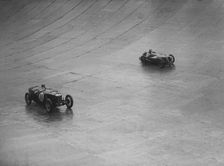 Riley 9 Brooklands and Austin 7 racing at a BARC meeting, Brooklands, Surrey, 1931 Artist: Bill Brunell