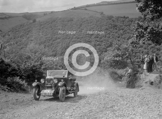 Riley 9 open 4-seater tourer at the Mid Surrey AC Barnstaple Trial, Beggars Roost, Devon, 1934. Artist: Bill Brunell.