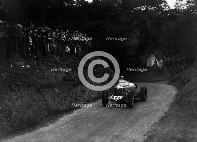 Riley competing in the Shelsley Walsh Hillclimb, Worcestershire, 1935. Artist: Bill Brunell.