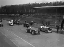 Riley Brooklands of H Hodgson and MG Magnette of H Levy, Donington Park, Leicestershire, 1935. Artist: Bill Brunell