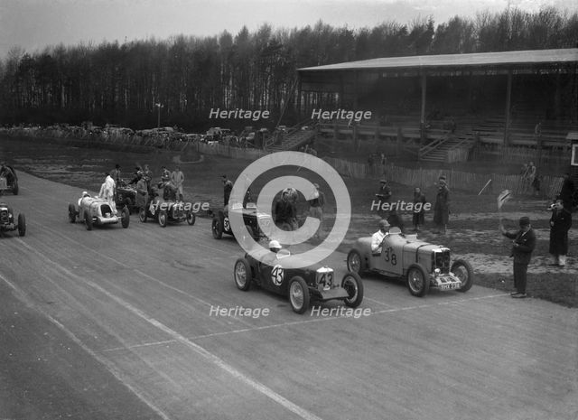 Riley Brooklands of H Hodgson and MG Magnette of H Levy, Donington Park, Leicestershire, 1935. Artist: Bill Brunell.