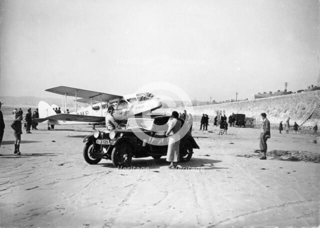 Riley Kestrel and a Dragon aircraft on a beach, 1934. Artist: Unknown