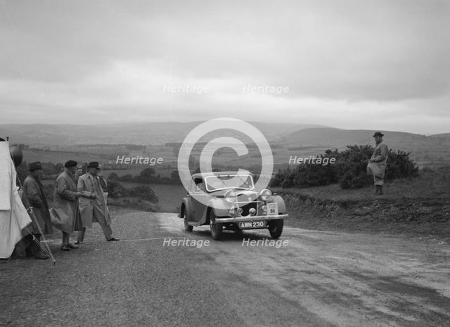 Riley Kestrel of A Bassett competing in the South Wales Auto Club Welsh Rally, 1937 Artist: Bill Brunell.