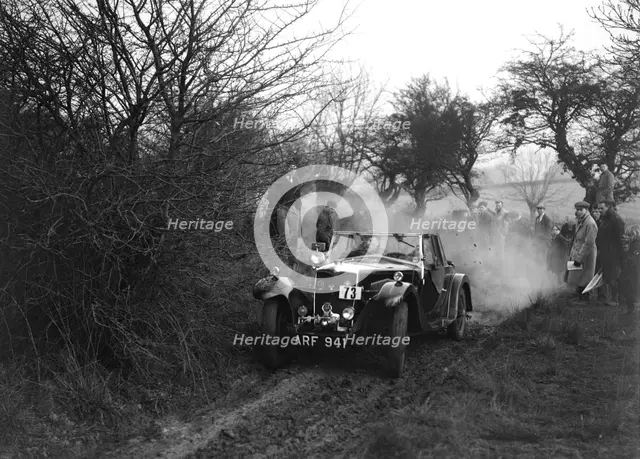 Riley of C Beddow at the Sunbac Colmore Trial, near Winchcombe, Gloucestershire, 1934. Artist: Bill Brunell.