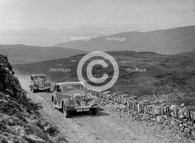 Riley of Miss F Walker leading a Hudson Eight at the RSAC Scottish Rally, 1936. Artist: Bill Brunell.