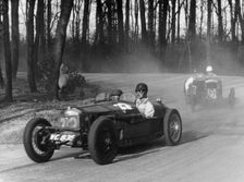 Riley leading a Fraser-Nash through Coppice Corner, Donington Park, Leicestershire, (c1930s?)